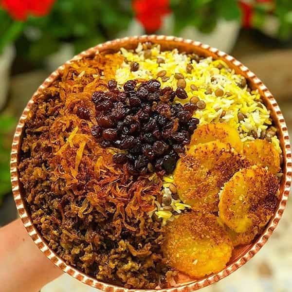 طرز تهیه عدس پلو با سس گوشت و کشمش + آموزش ویدئویی